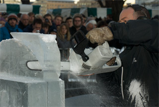 Ice sculptor from the UK using chain saw to form his sculpture